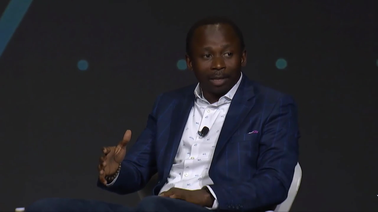 Amas speaking at 2022 panel event